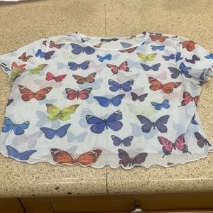 Waist length sheer top primarily white w all colored butterflies